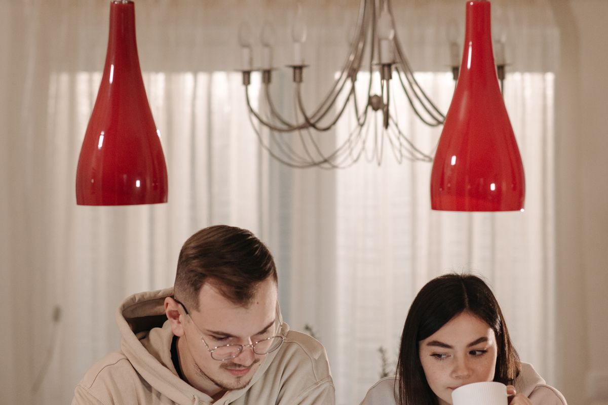 A pair reviewing records on screen