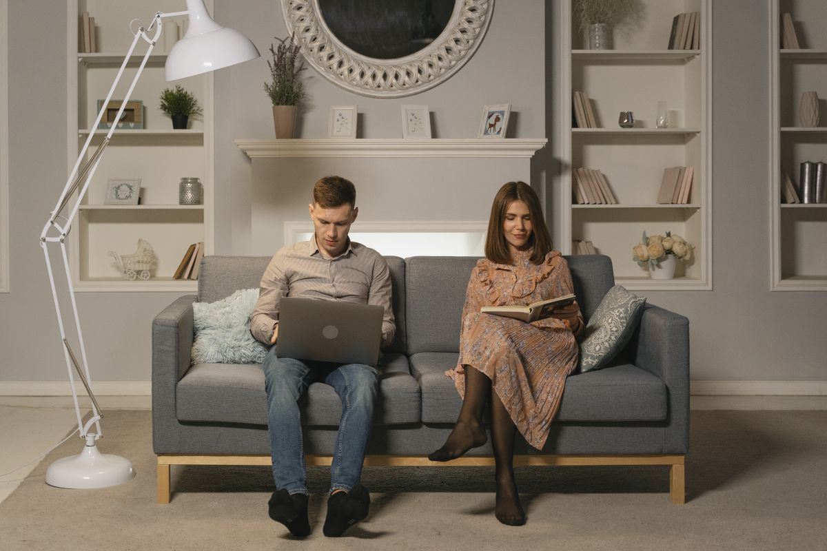 Two colleagues going through work on a laptop